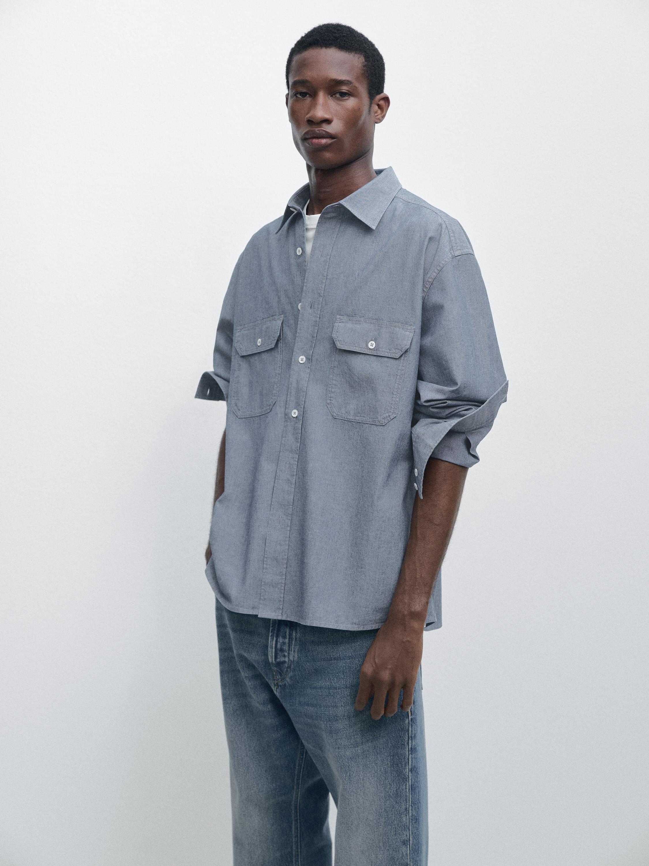 Camisa chambray regular fit detalle bolsillos