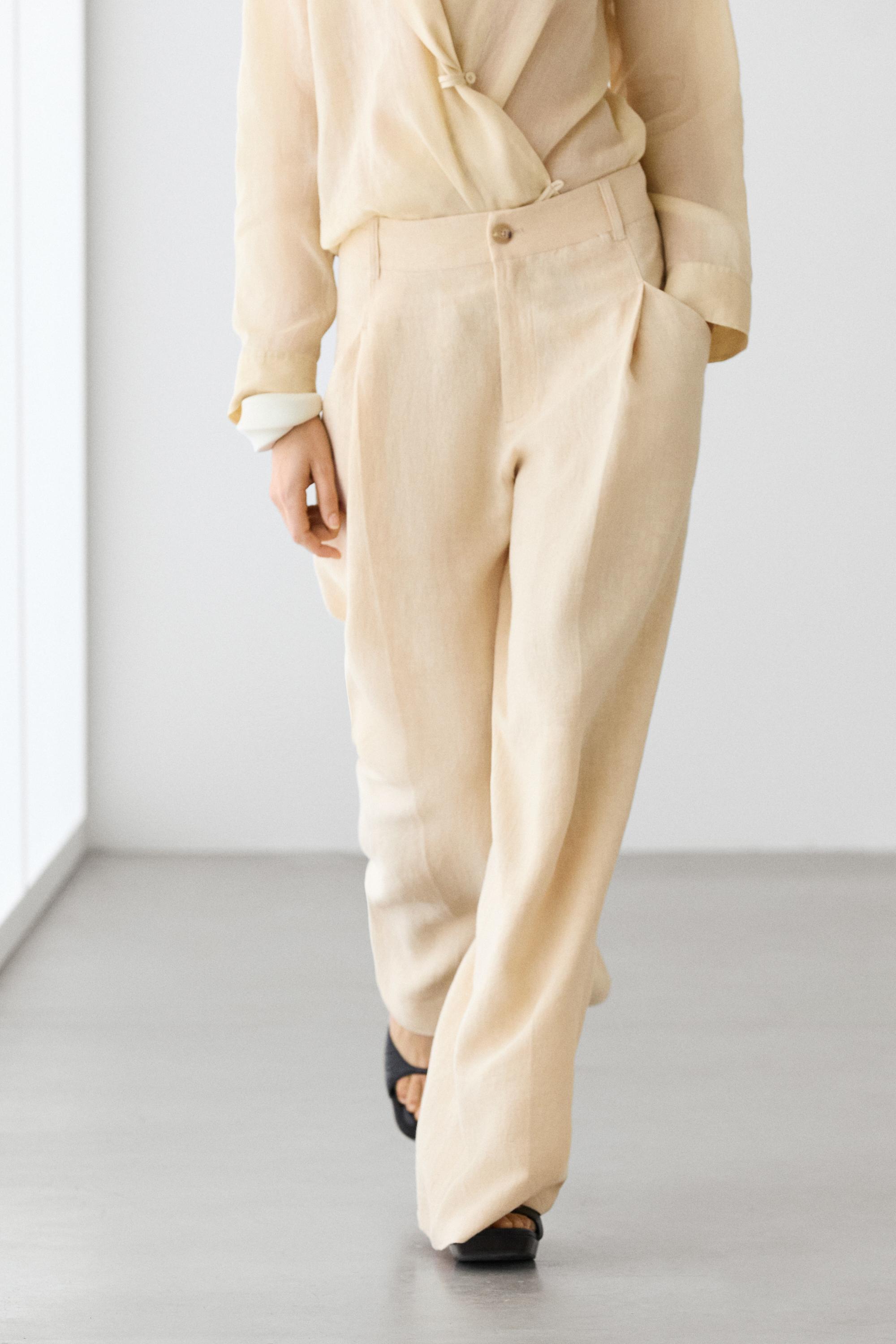 Pantalón wide leg detalle bolsillos lino