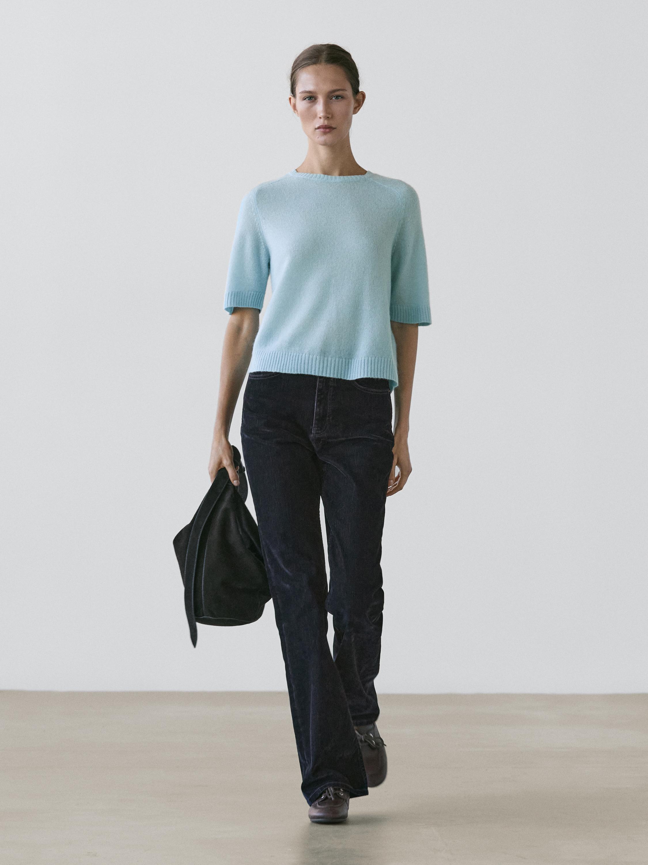 Jeans bootcut fit tiro alto flock