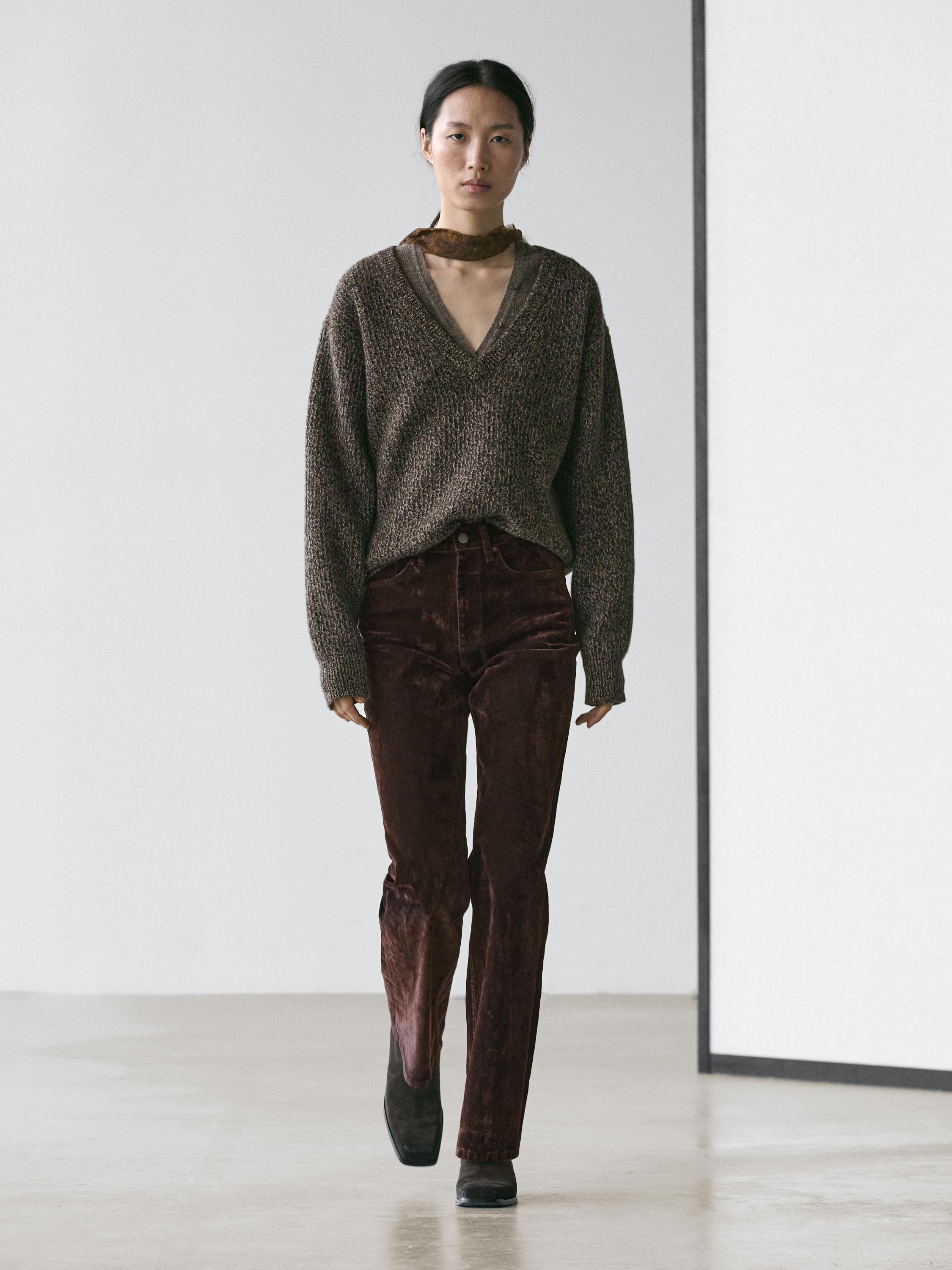 Jeans bootcut fit tiro alto flock