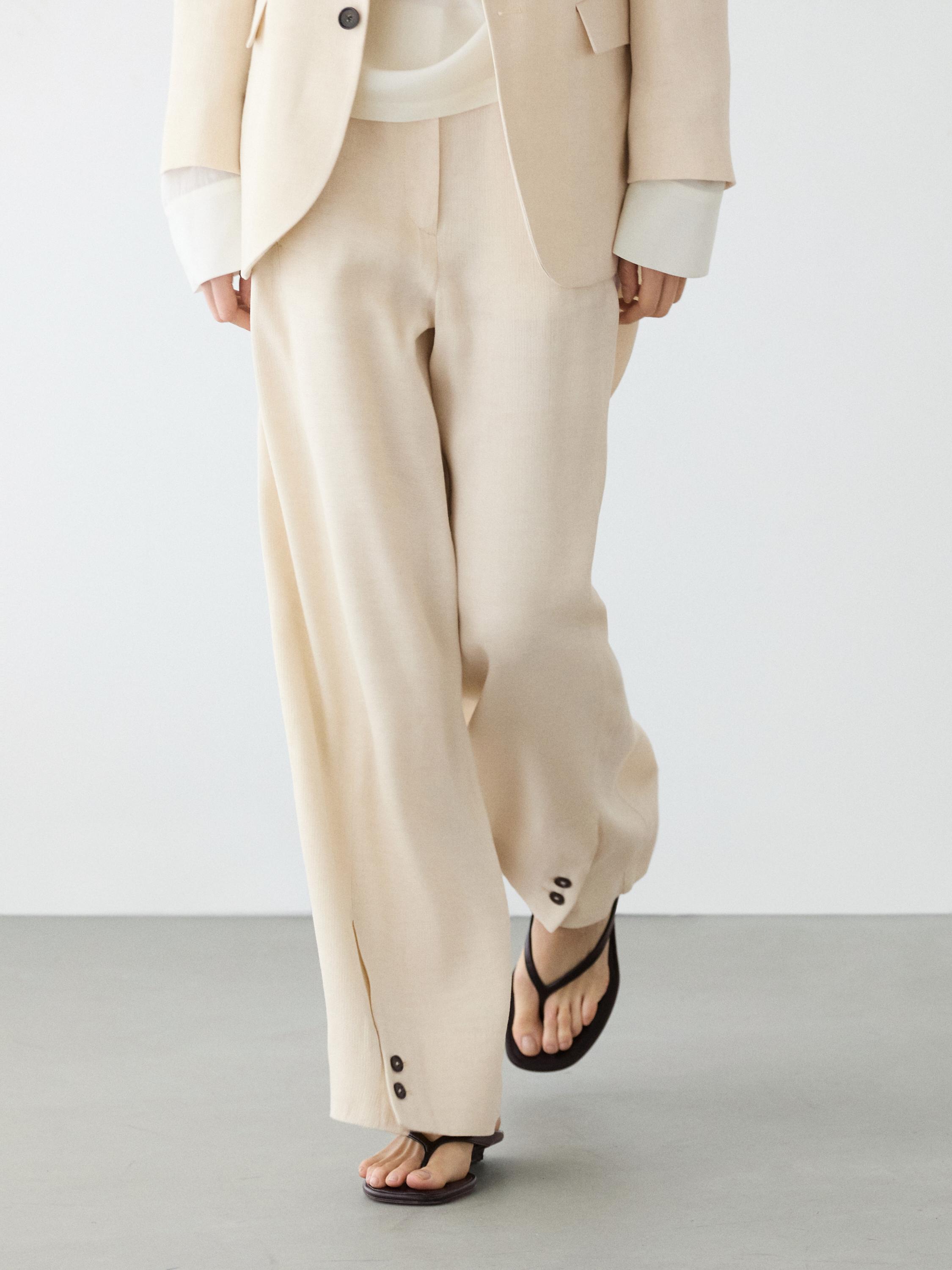 Pantalón traje detalle botón con lino