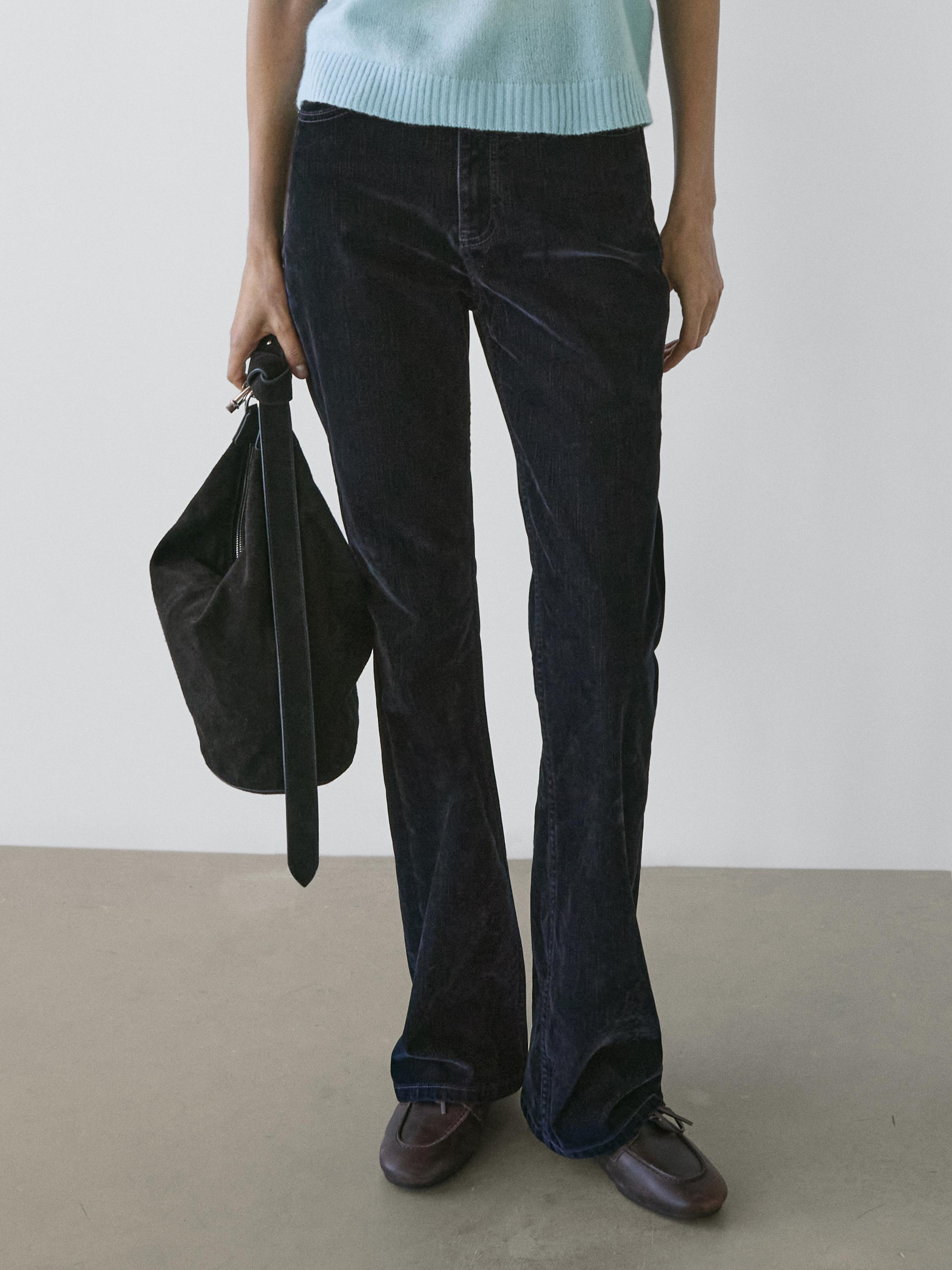 Jeans bootcut fit tiro alto flock