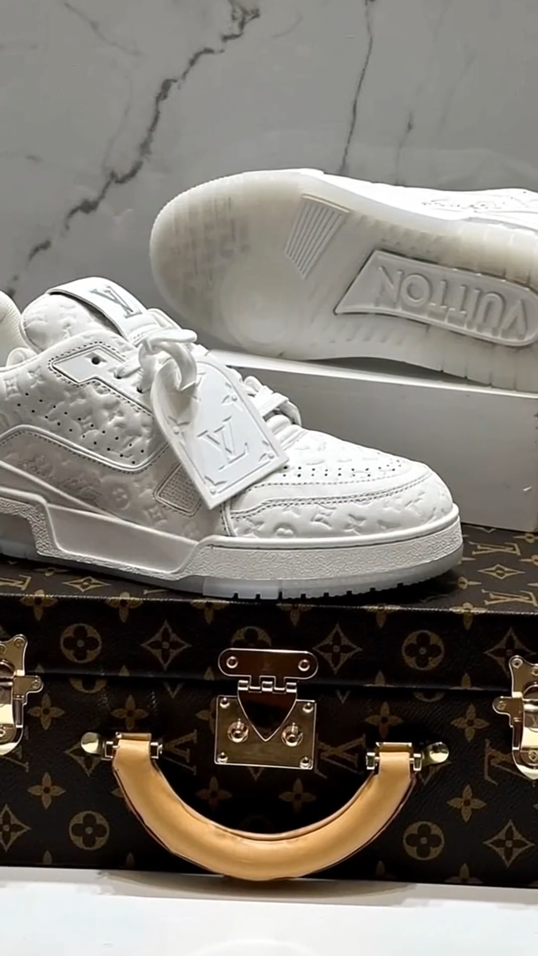 LV  Trainer Sneaker – Triple White Monogram Embossed Edition