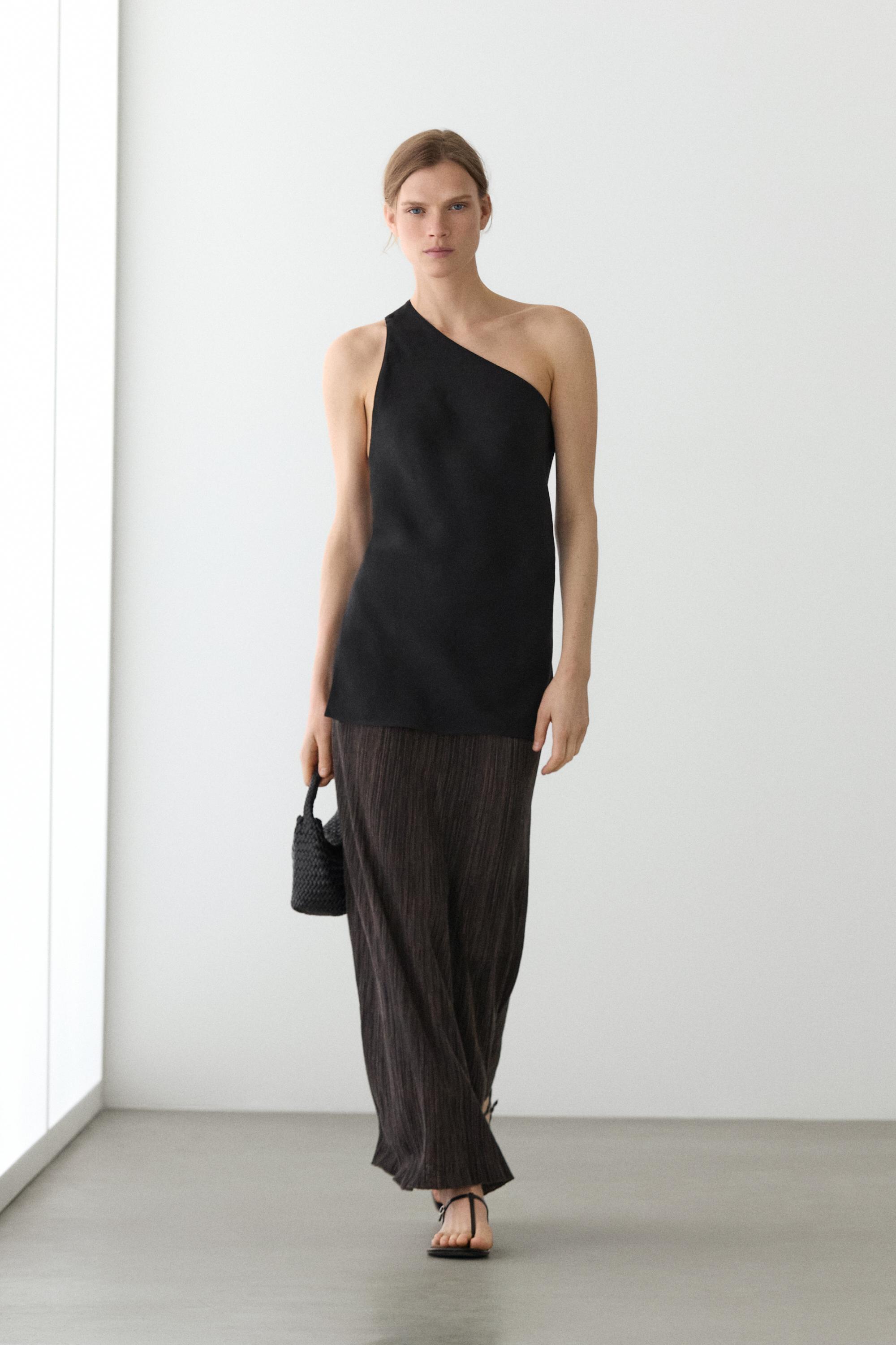 Falda midi plisada total look detalle rayas