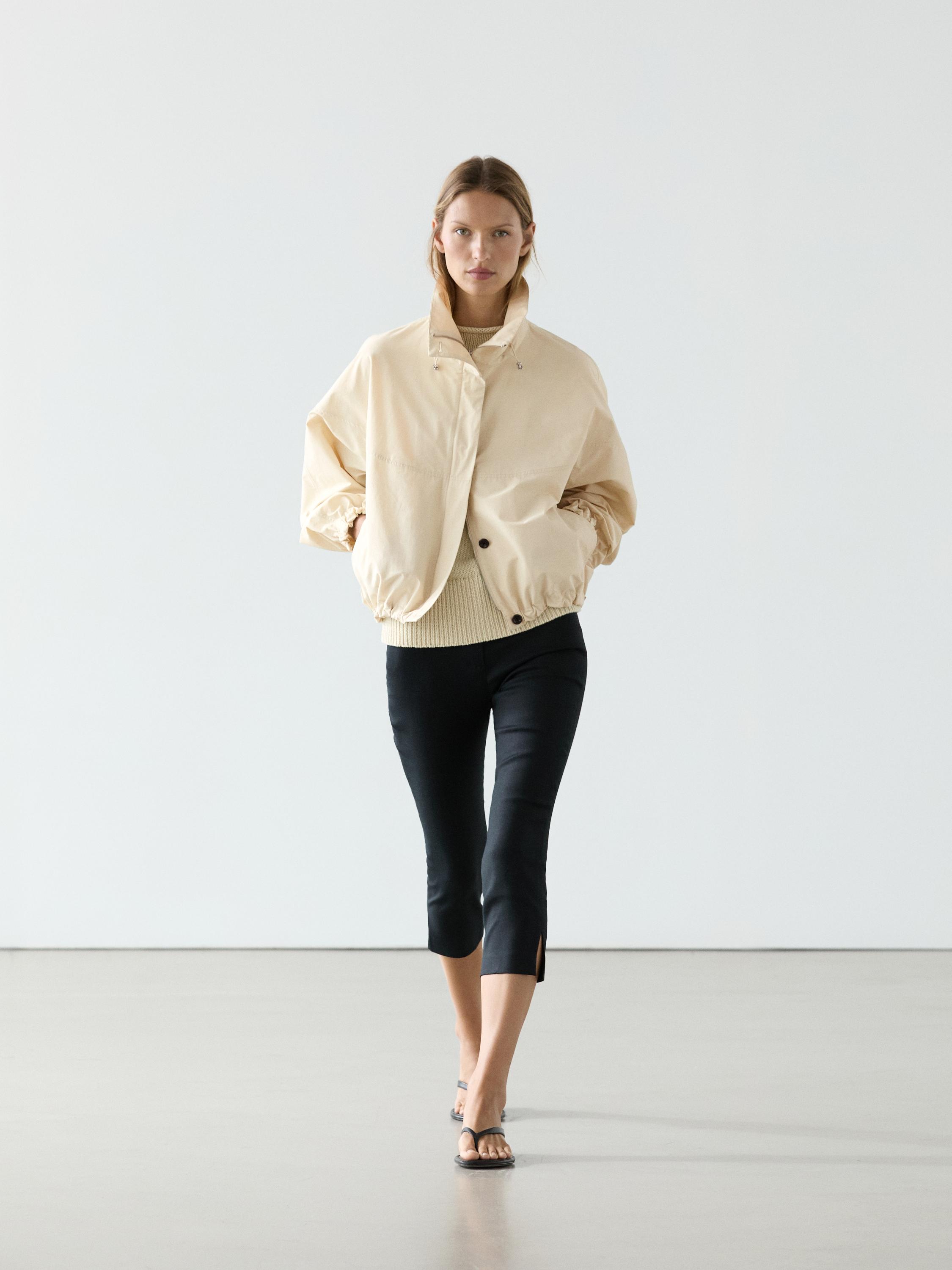 Chaqueta bomber abullonada cuello alto