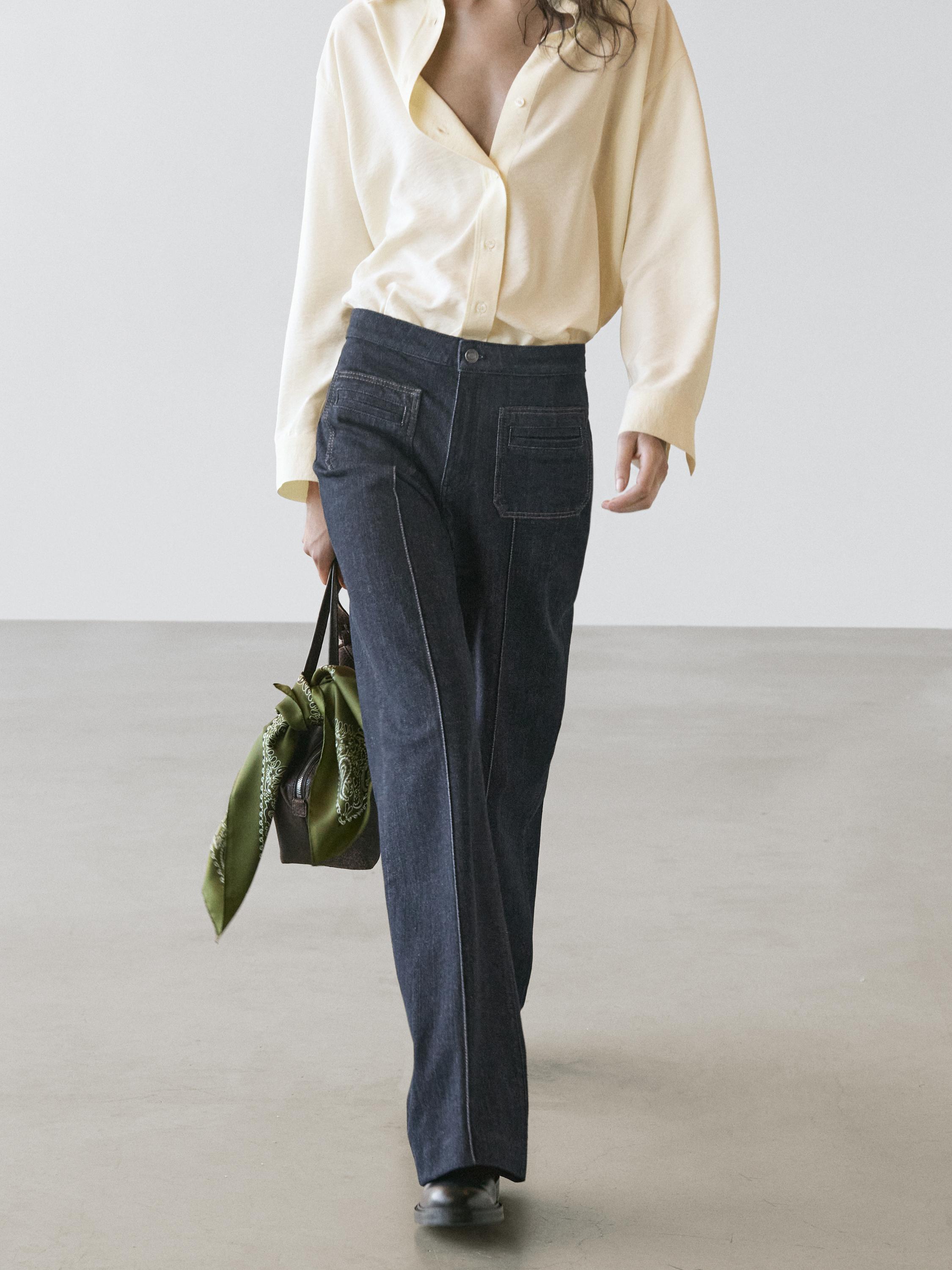 Jeans flare fit tiro alto bolsillos