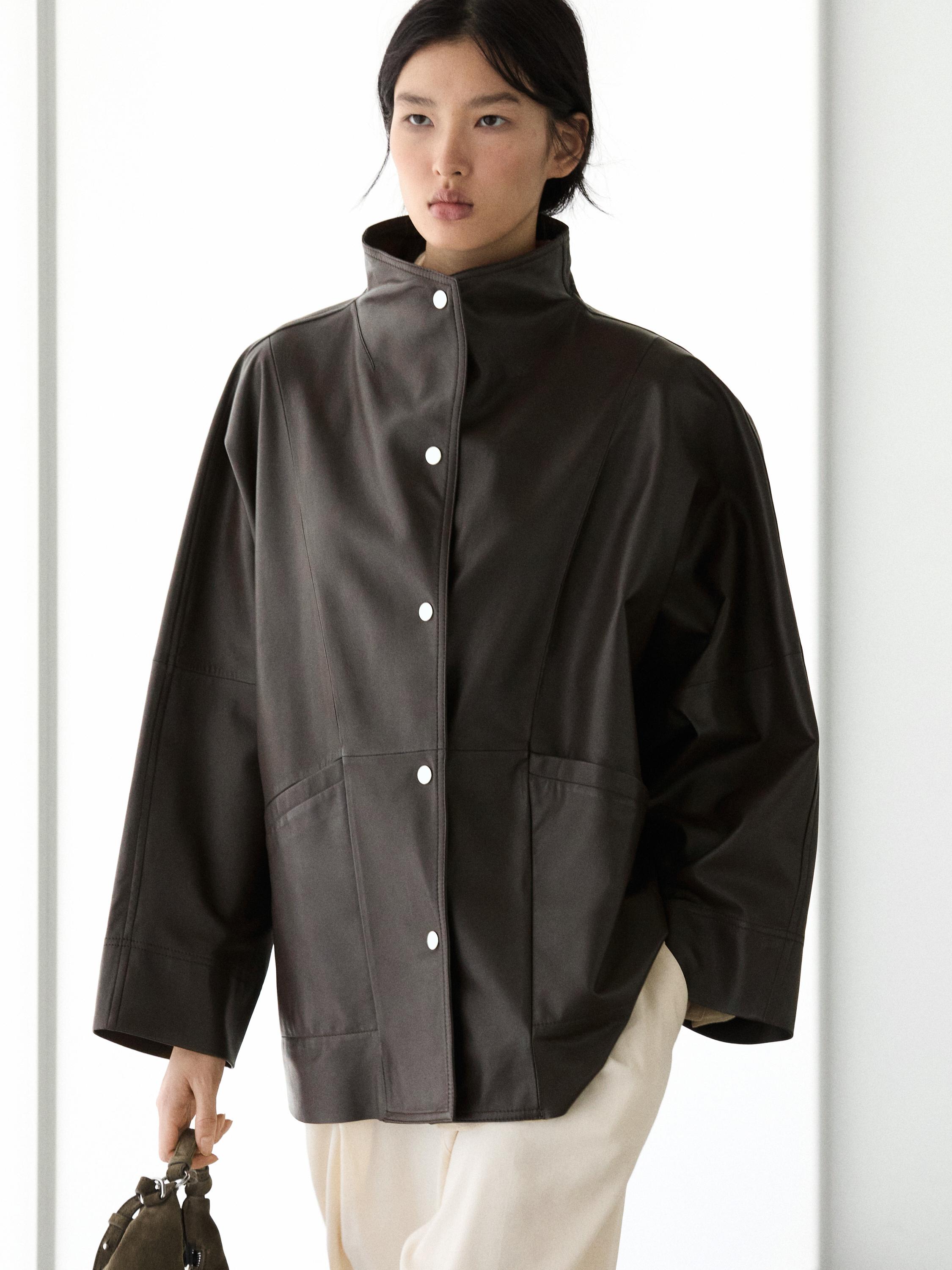 Parka capa bolsillos piel napa