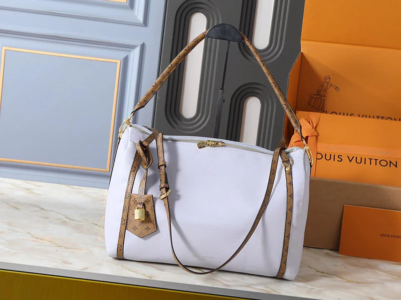 Genuine leather (3 Colors) Small:10.2″x6.7″x1.4″ Medium:14.2″x9.4″x7.3″ Woman’s Handbag with a bag charmBB-16048