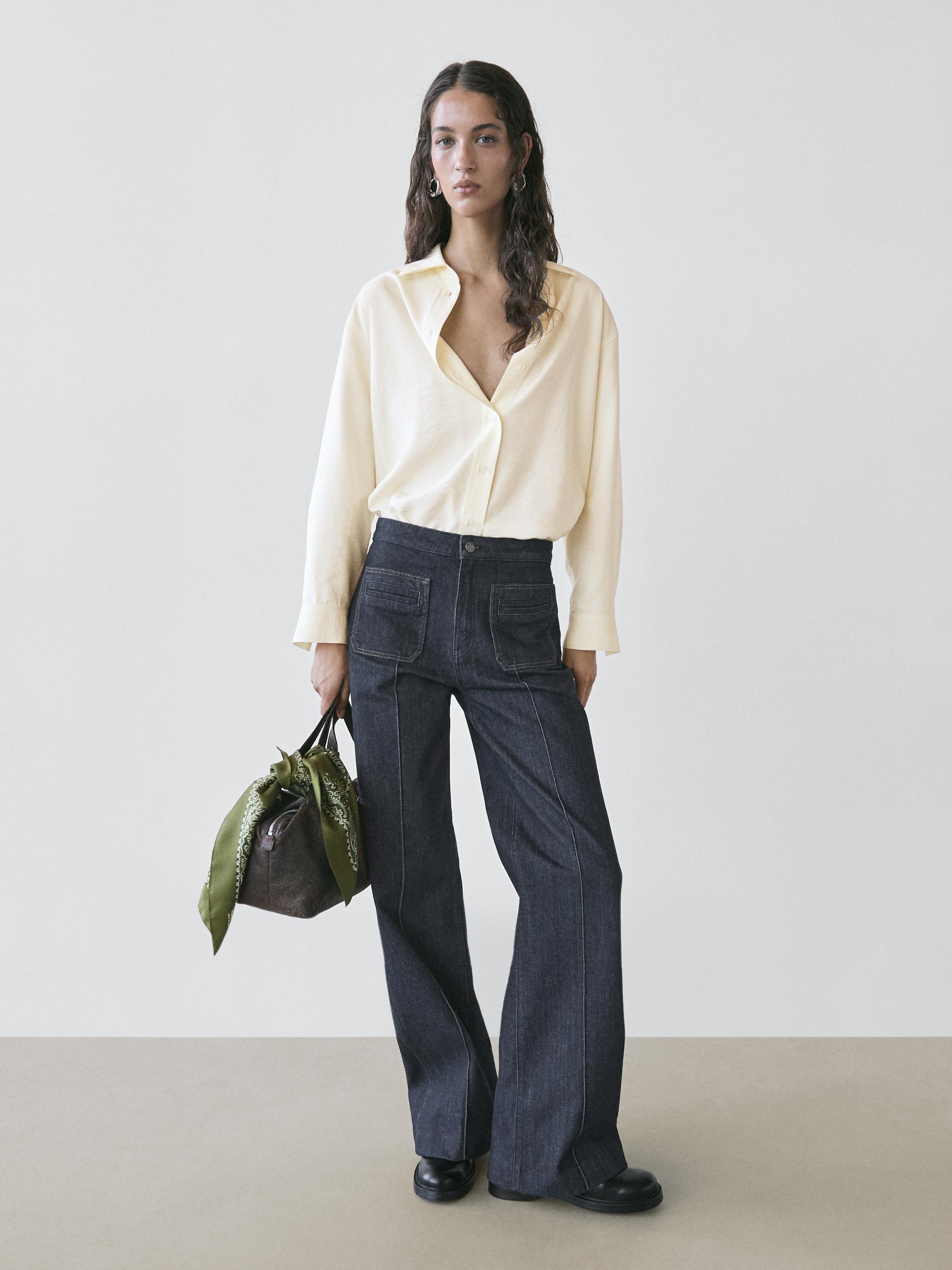 Jeans flare fit tiro alto bolsillos