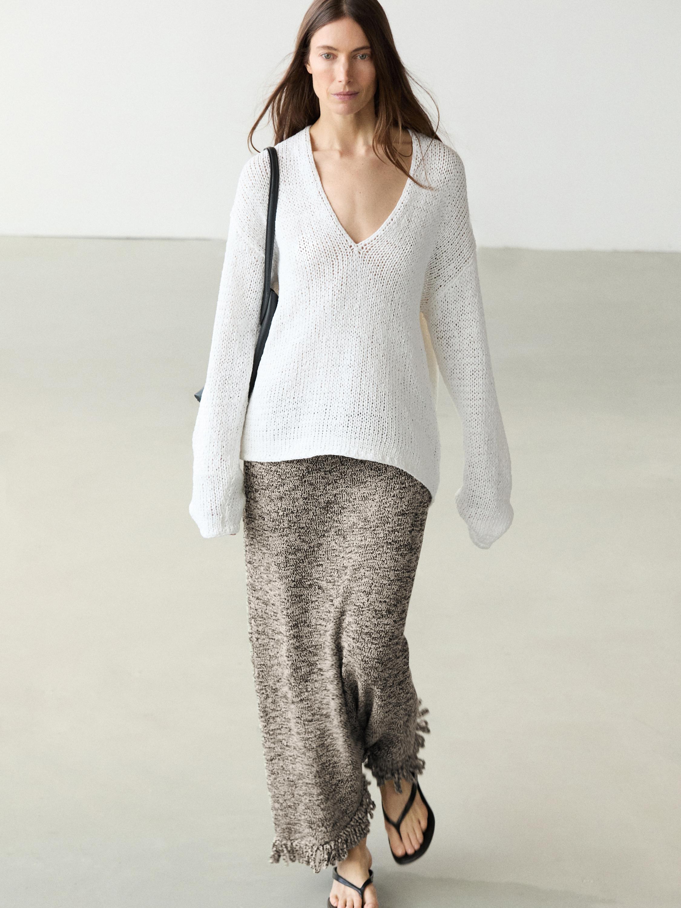 Falda punto detalle flecos total look