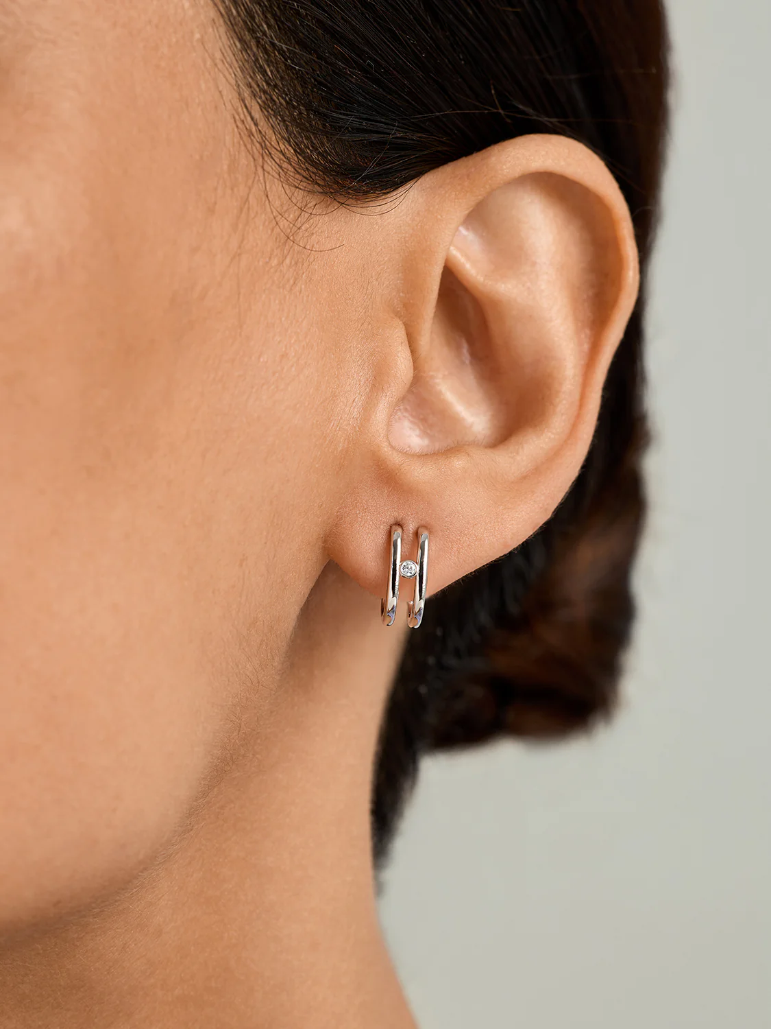 Double Curve Sapphire Huggies