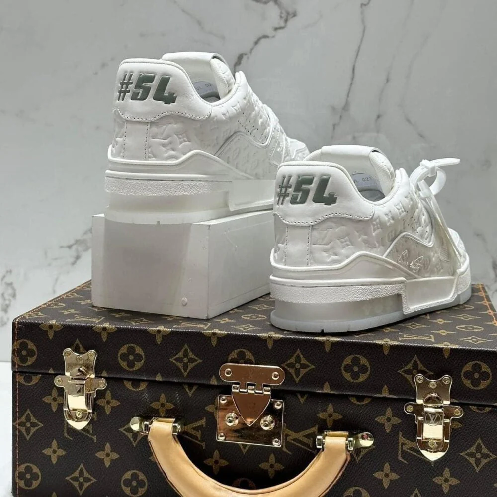 LV  Trainer Sneaker – Triple White Monogram Embossed Edition