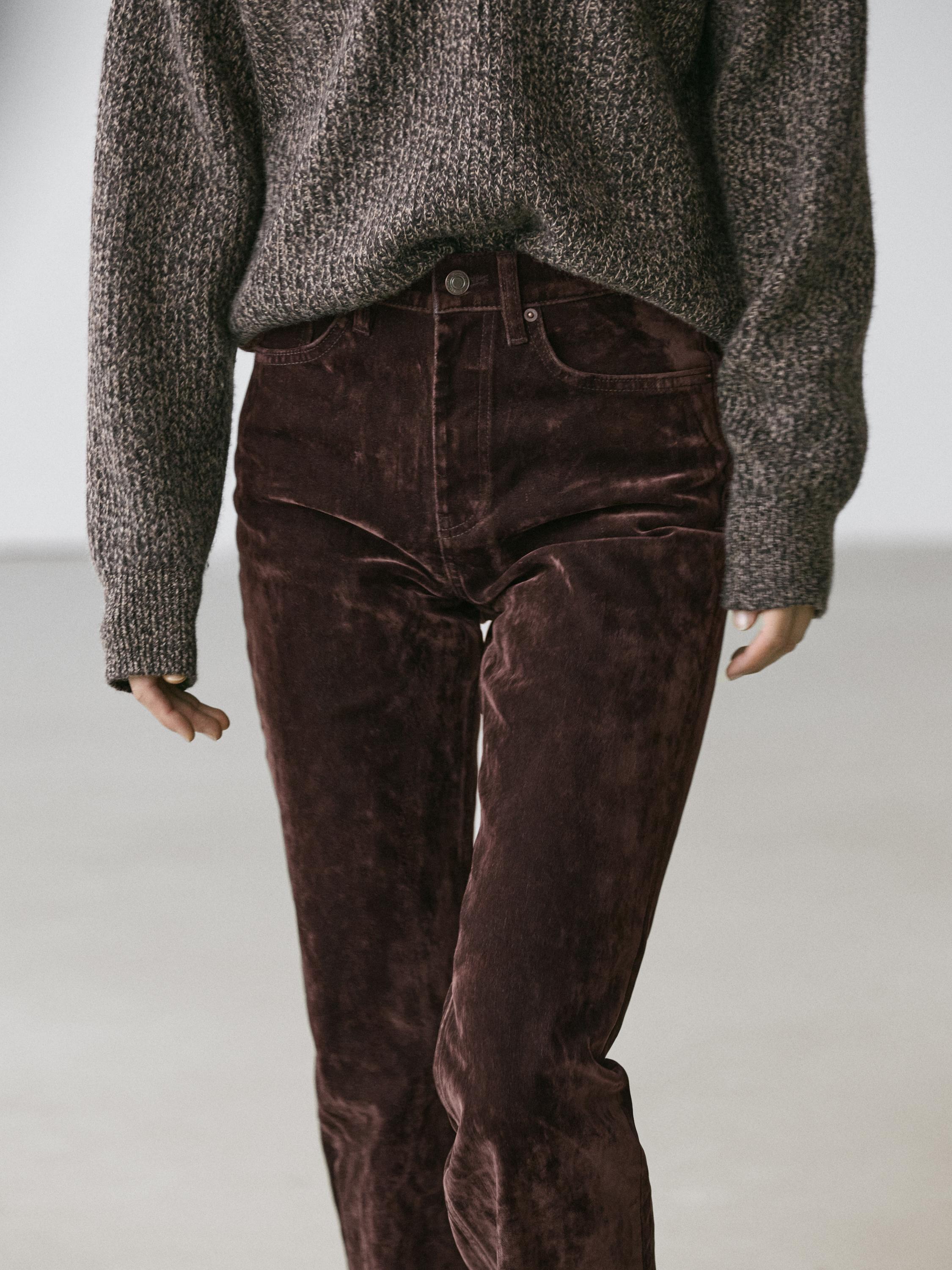 Jeans bootcut fit tiro alto flock