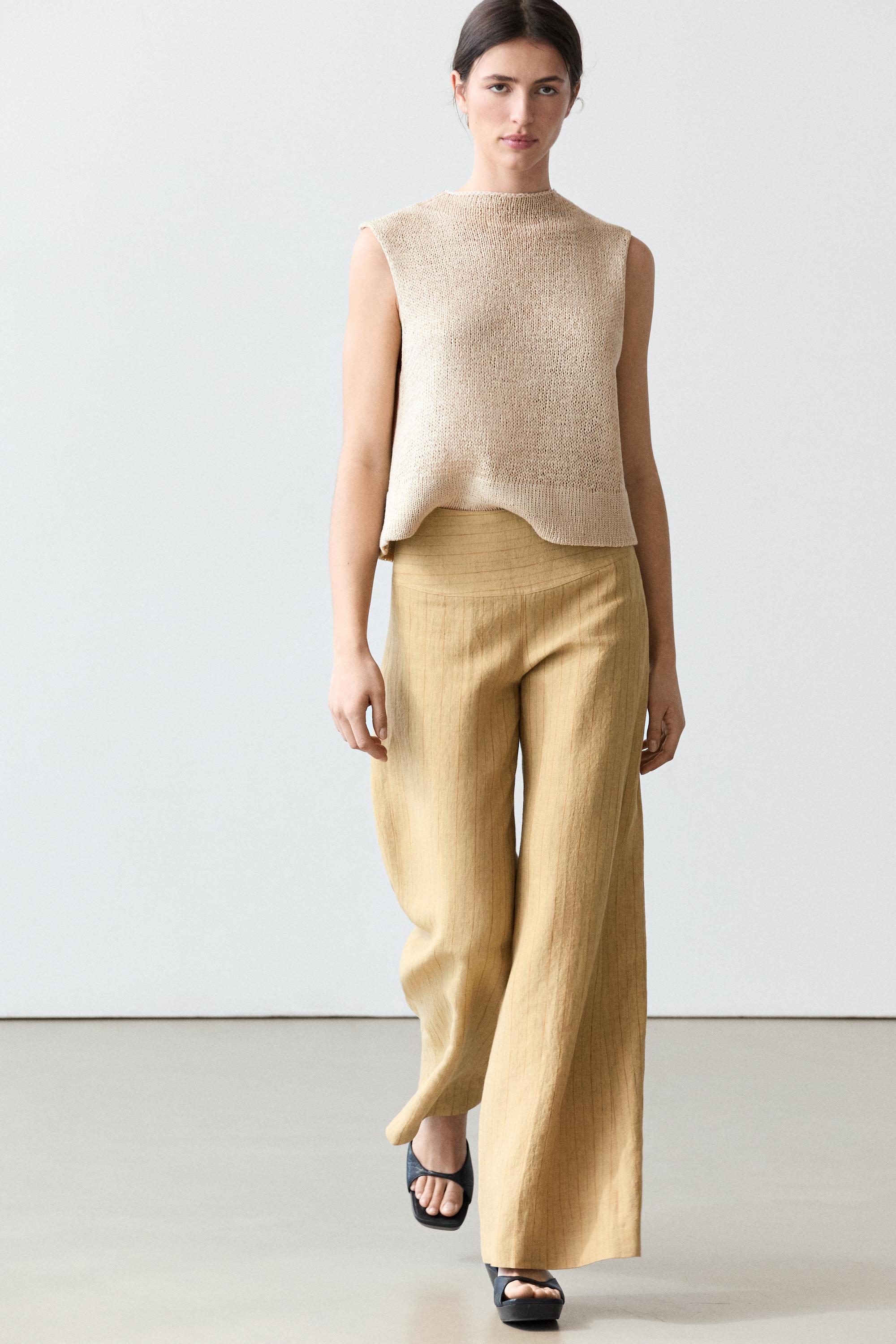 Pantalón flare fit detalle rayas lino