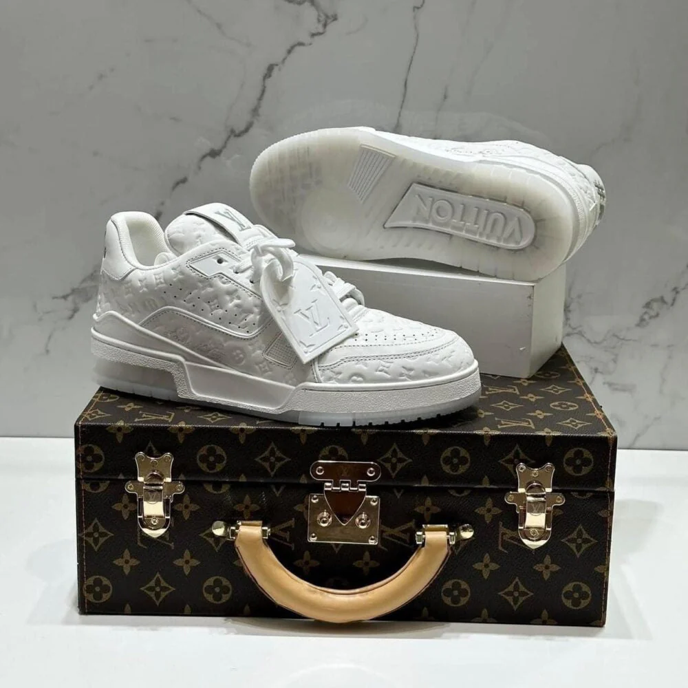 L.V  Trainer Sneaker – Triple White Monogram Embossed Edition