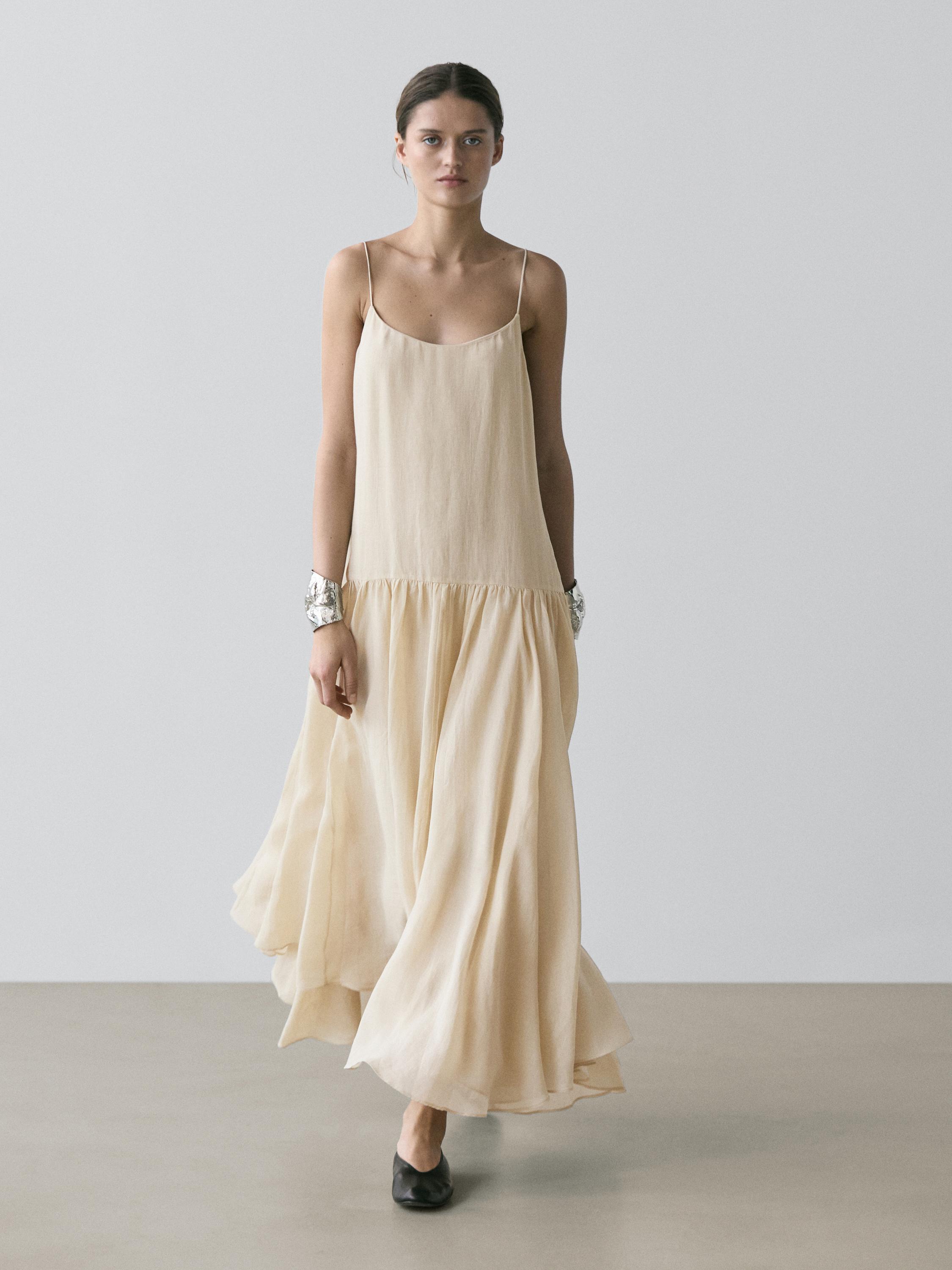 Vestido midi fluido detalle plisado