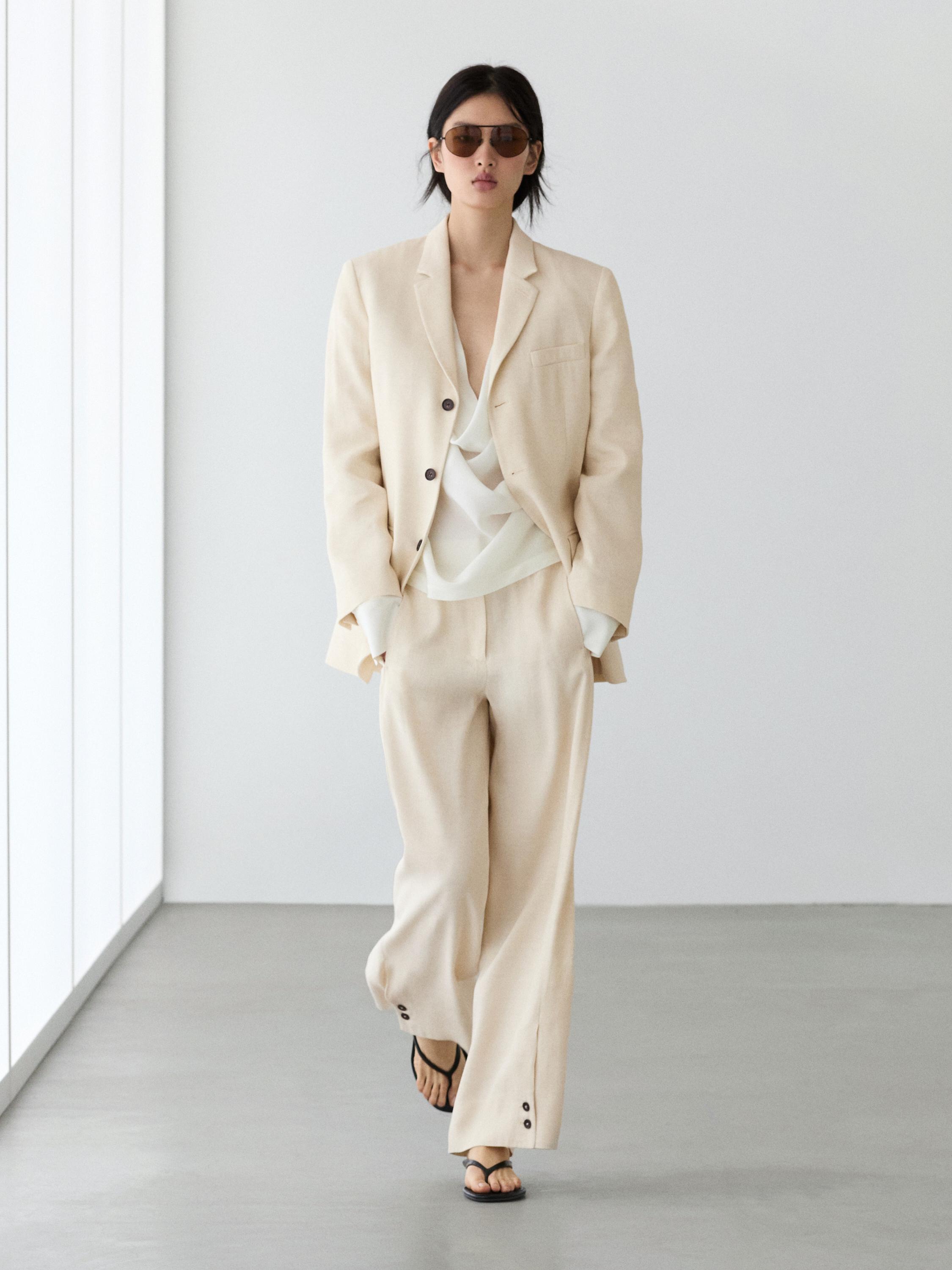 Pantalón traje detalle botón con lino