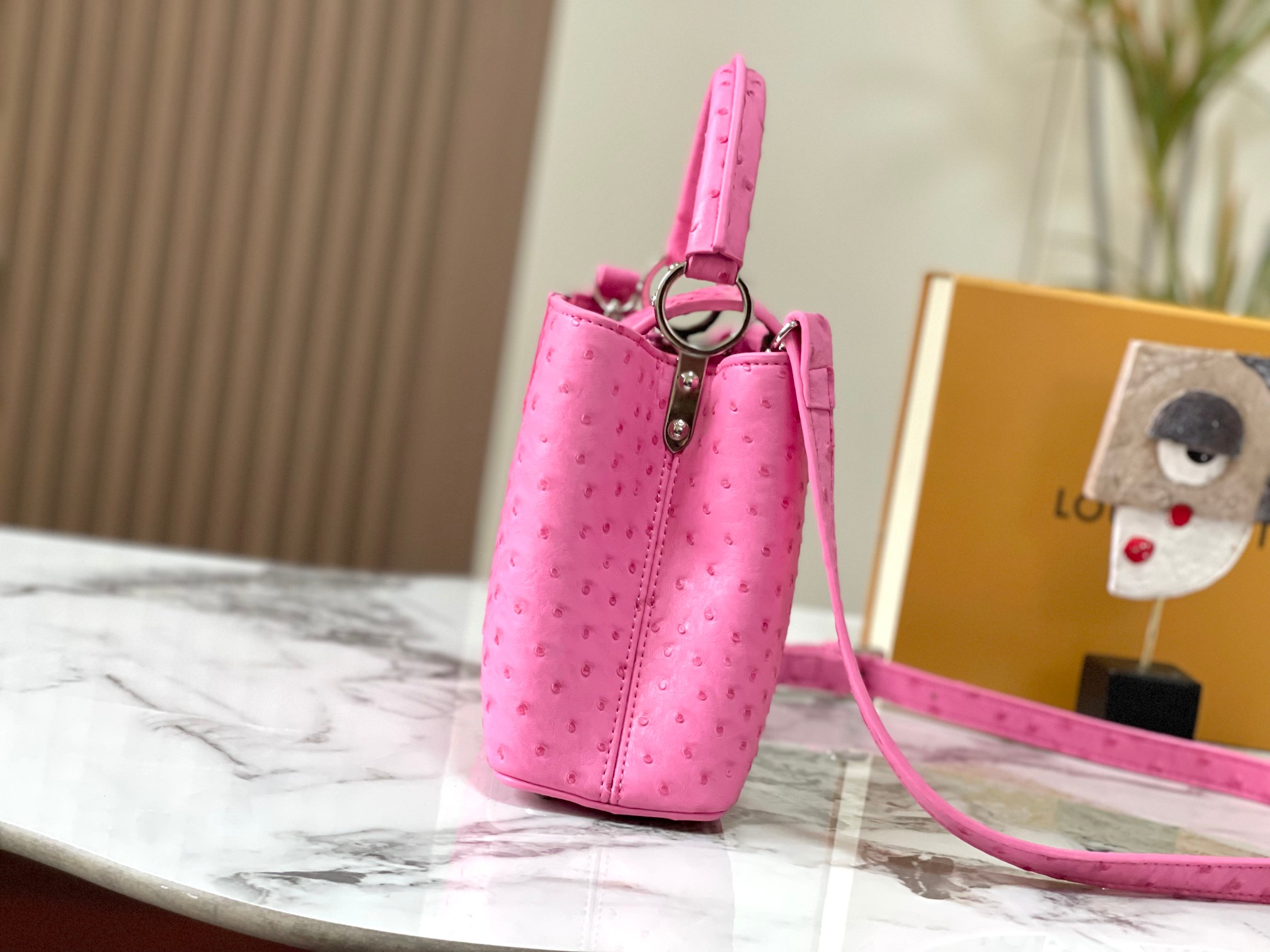 Capucines ostrich leather handbag