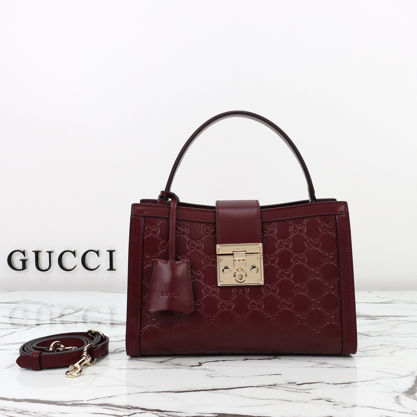 Gucci Padlock Medium top handle bag in Rosso Ancora red GG leather