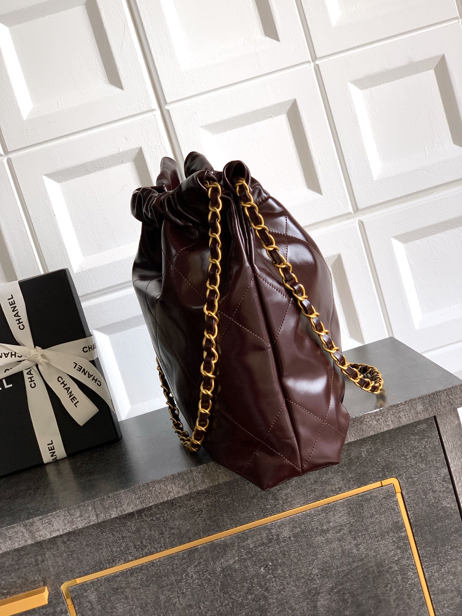 CHANEL 22 Handbag Shiny Calfskin & Gold-Tone Metal Dark Brown