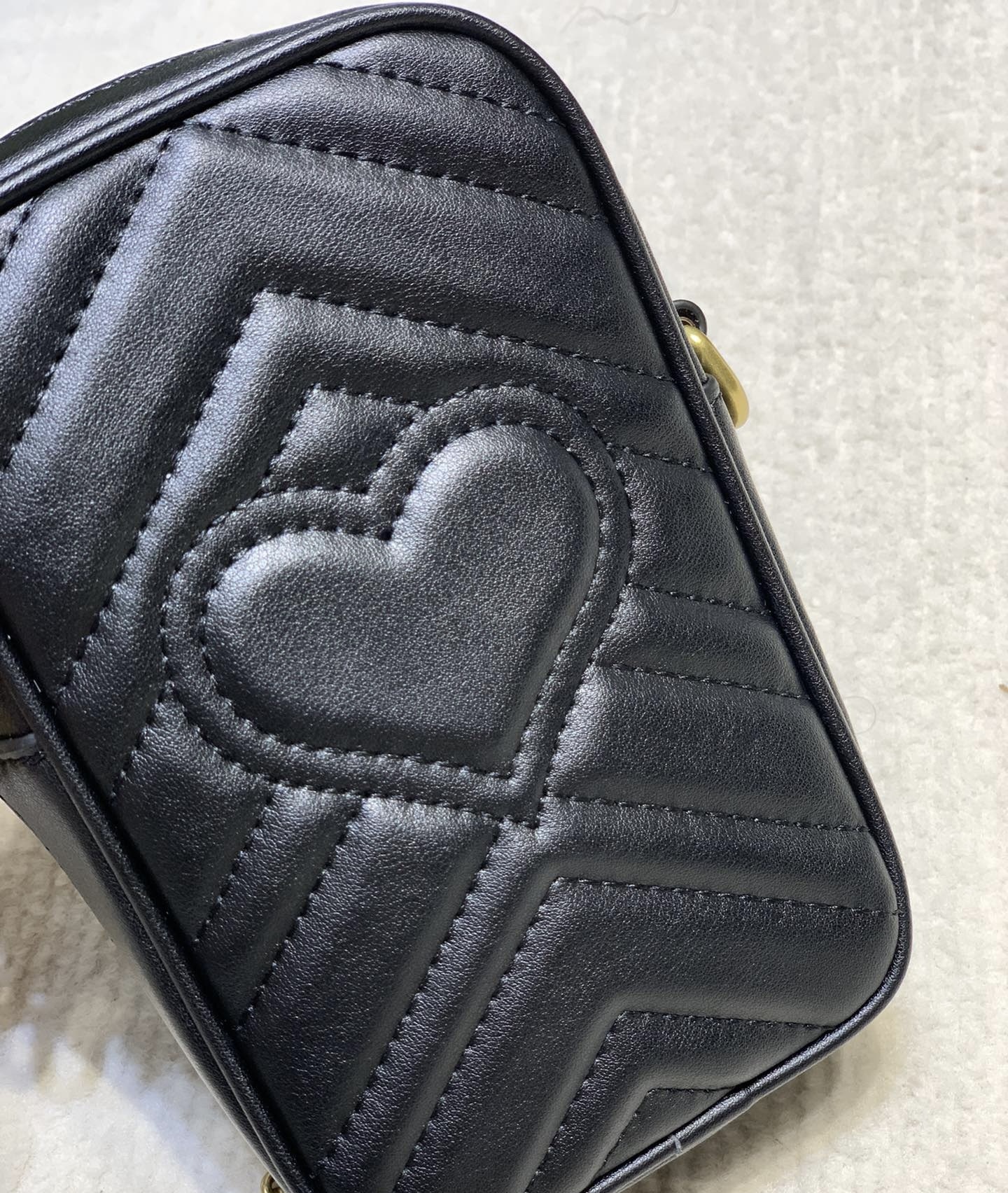 GUCCI GG Marmont mini quilted leather pouch