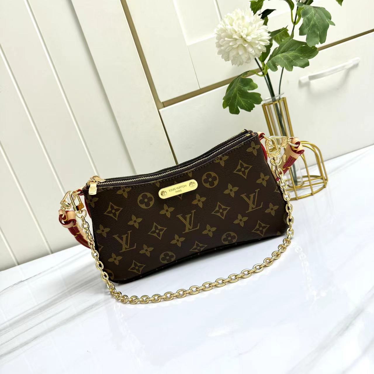 Louis Vuitton Monogram M83008 Liv Pochette