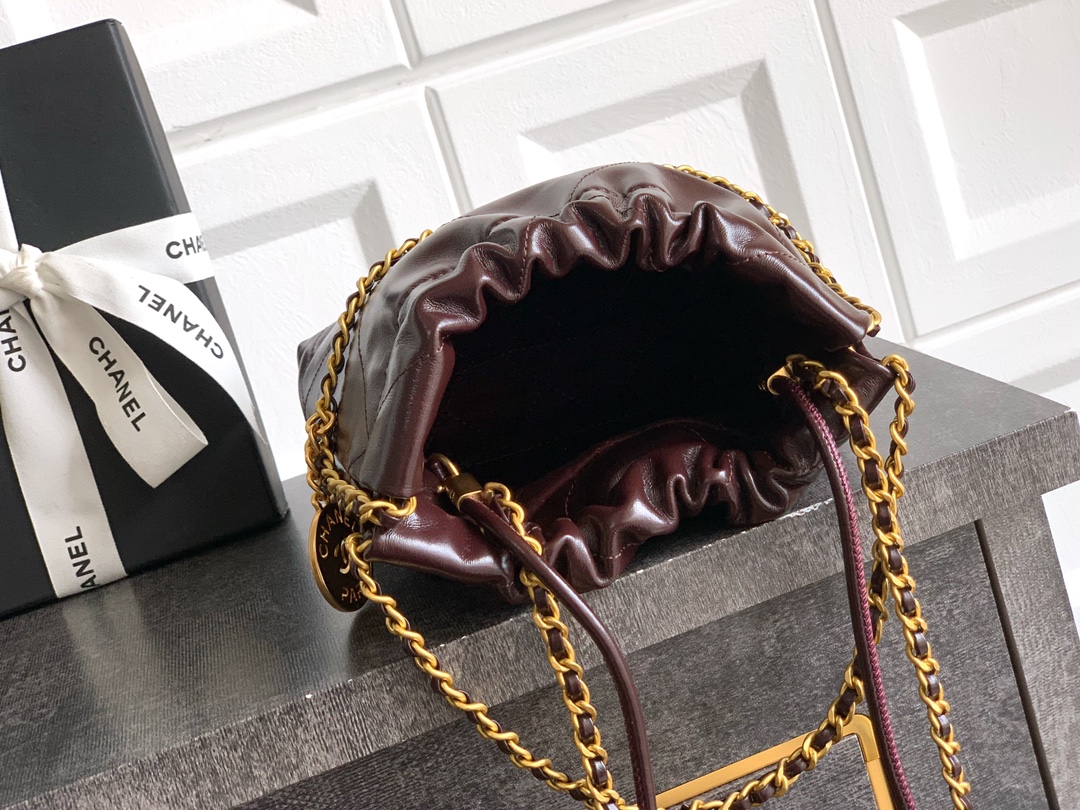 CHANEL 22 Handbag Shiny Calfskin & Gold-Tone Metal Dark Brown