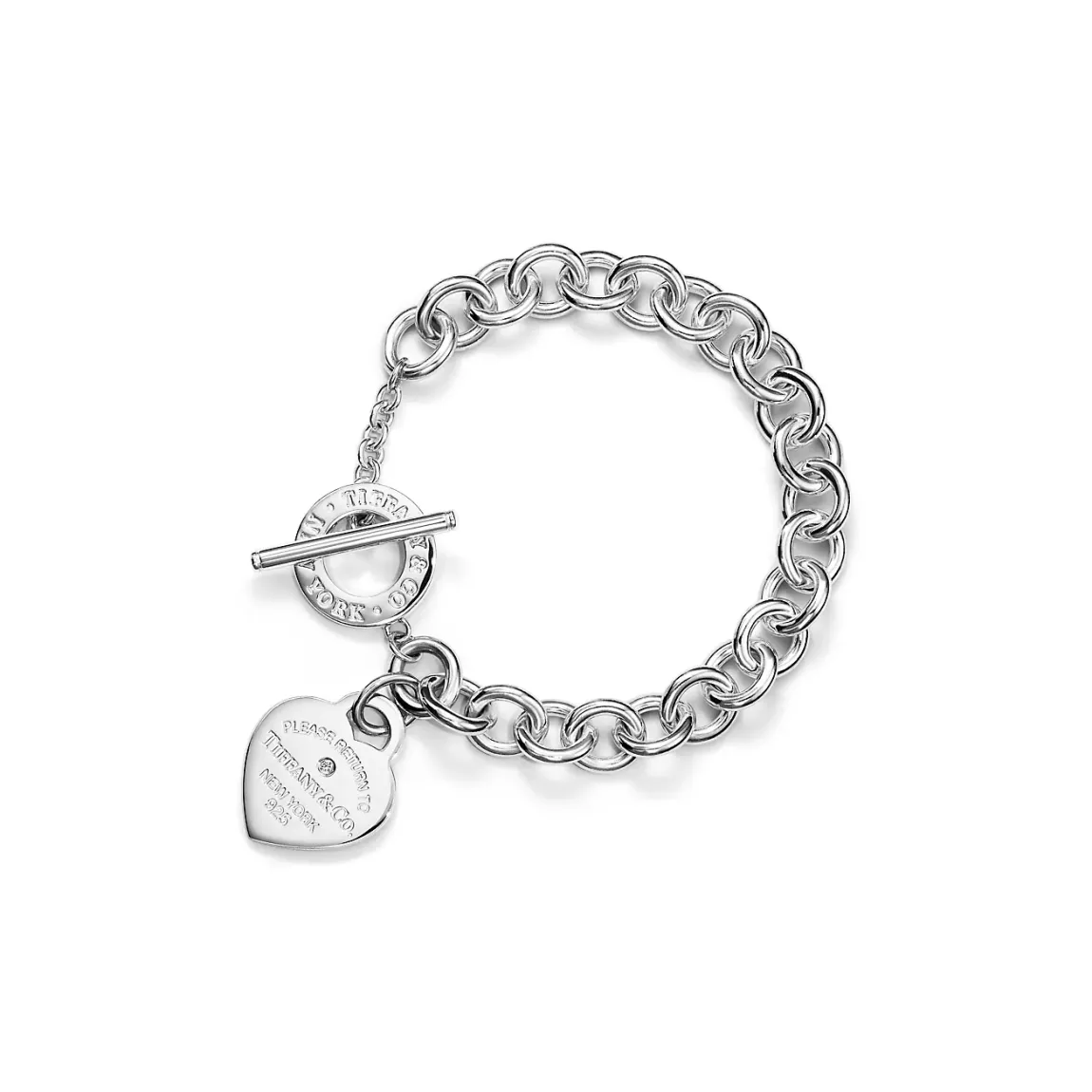 Tiffany sterling silver link bracelet features the iconic heart tag set with a round brilliant diamond and an oversized toggle closure