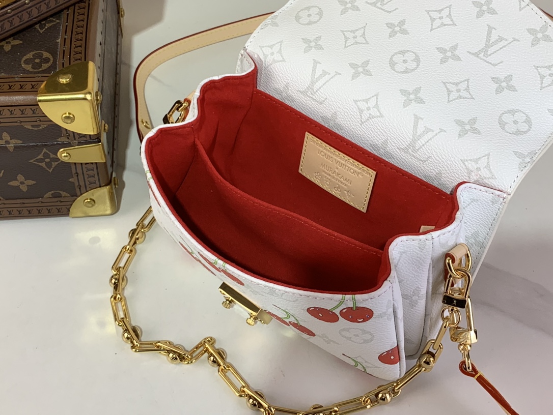 M14231 New LV x TM Pochette Métis East West