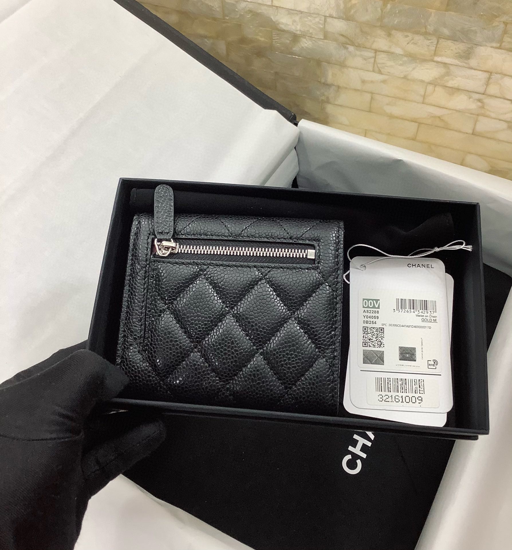 CHANEL Pebbled Leather Tri-Fold Wallet