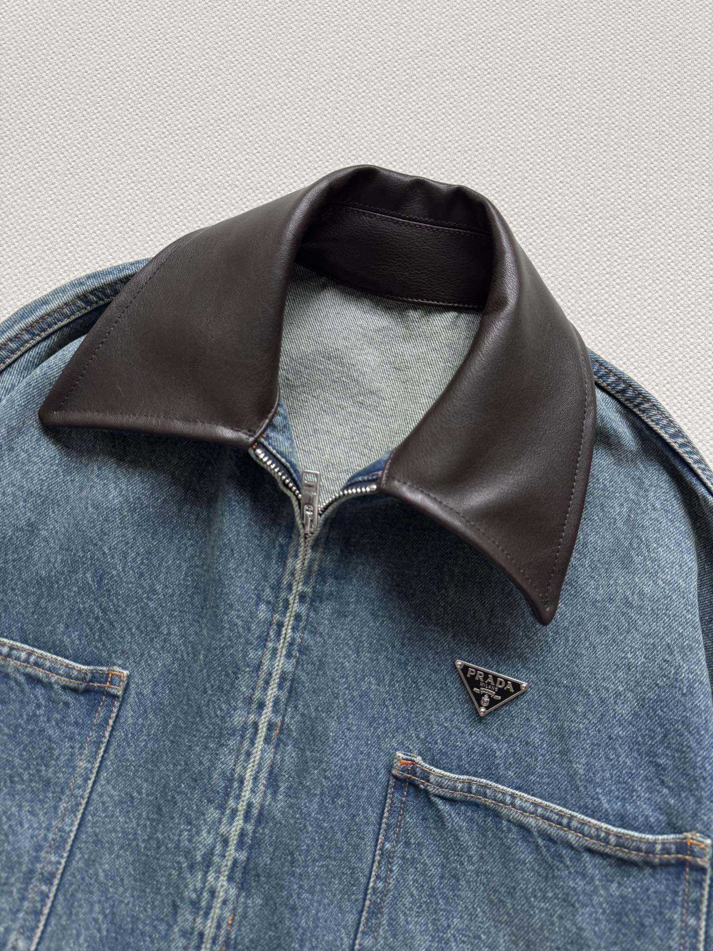 Prada Cropped leather-trimmed denimjacket in blue