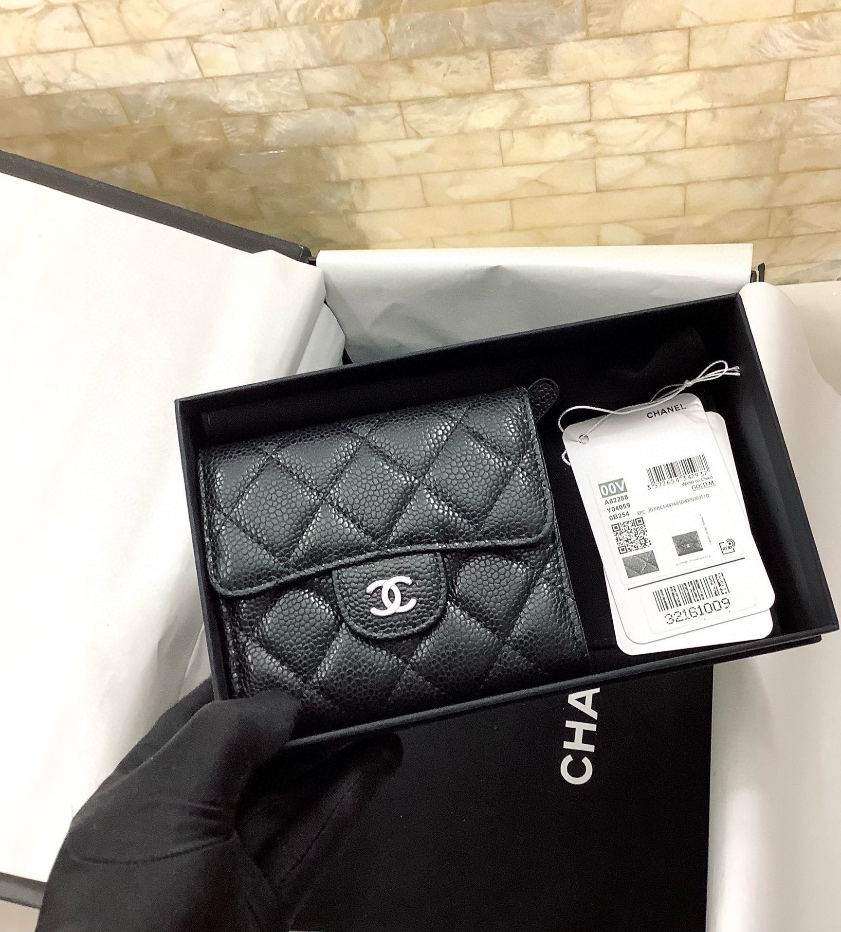 CHANEL Pebbled Leather Tri-Fold Wallet