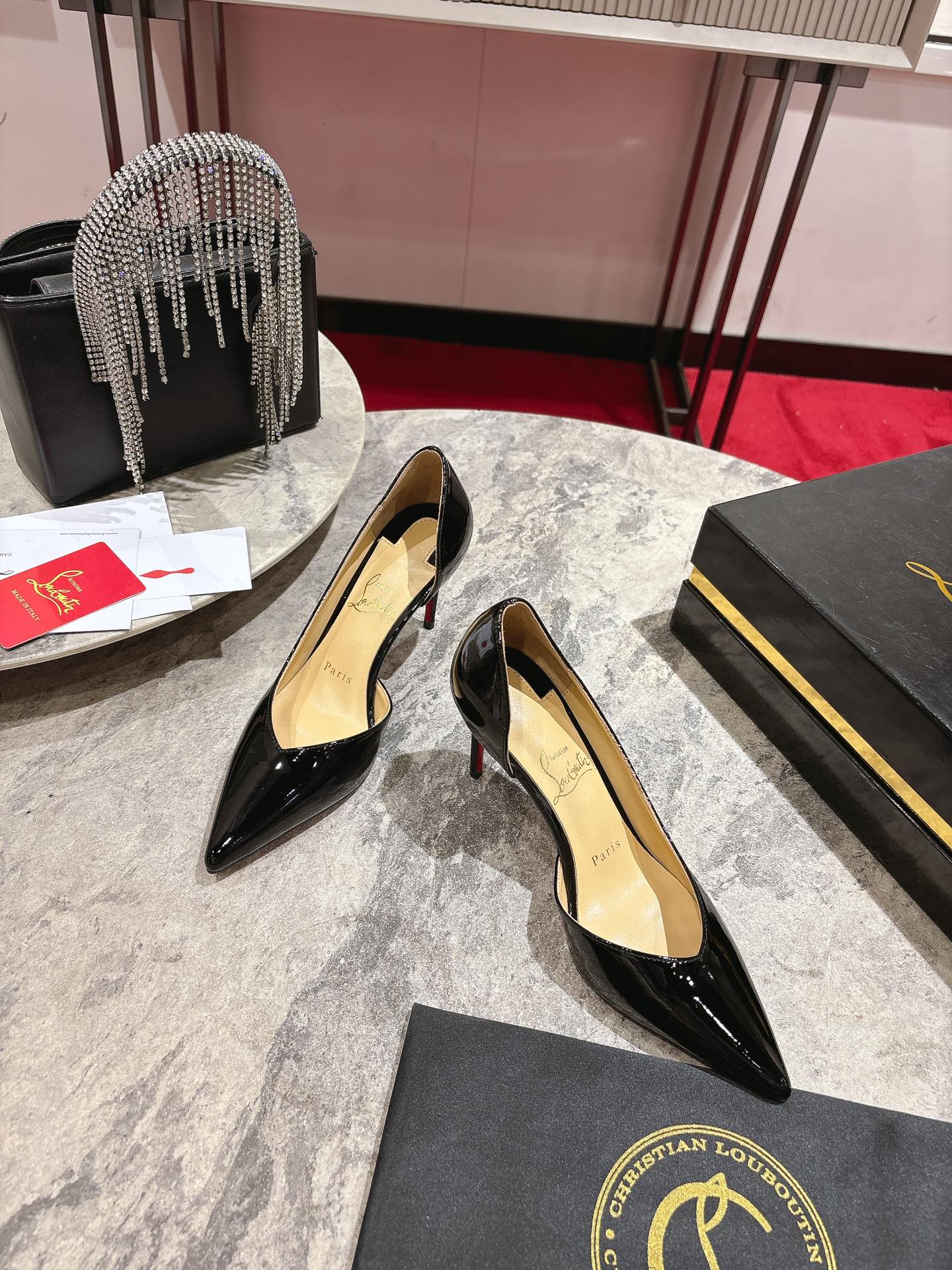 CHRISTIAN LOUBOUTIN Iriza patent-leather pumps