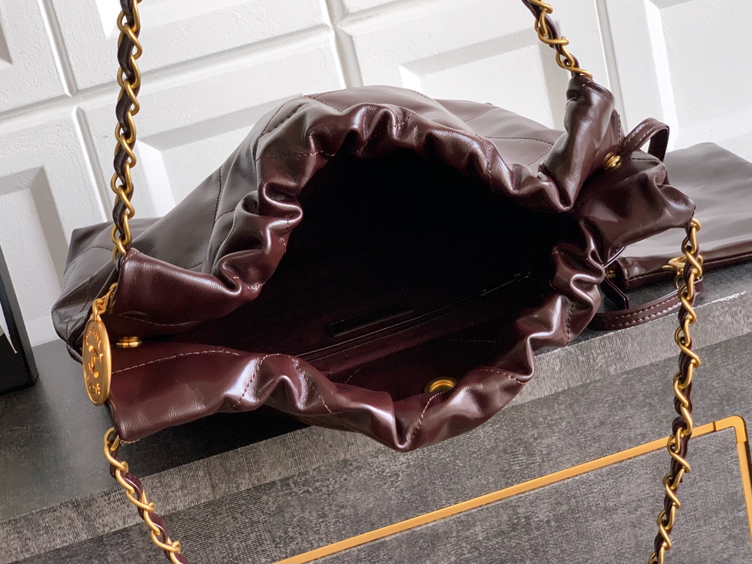 CHANEL 22 Handbag Shiny Calfskin & Gold-Tone Metal Dark Brown
