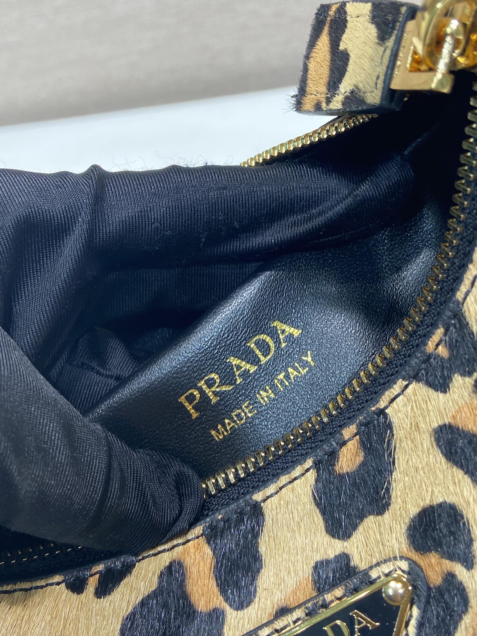 Prada Arqué leather shoulder bag leopard