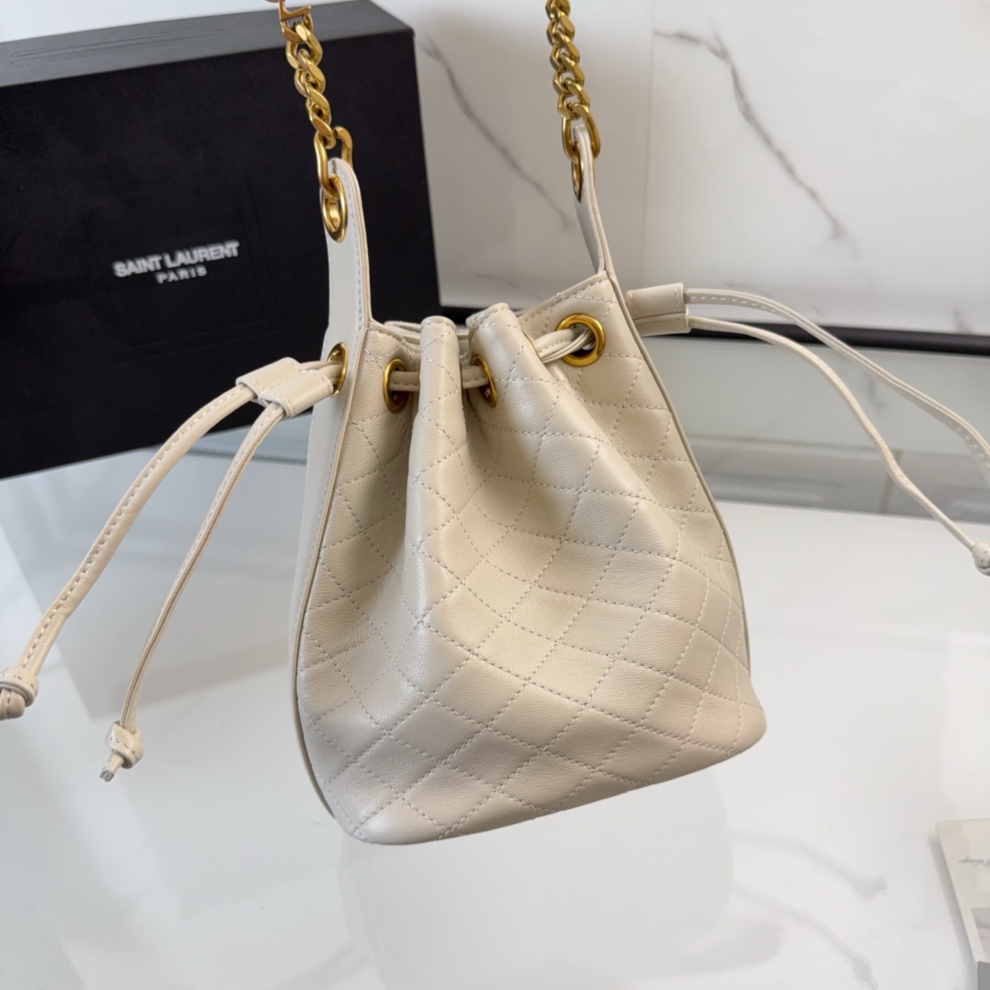 YSL Cassandre Bucket Bag In Lambskin 'Crema Soft'