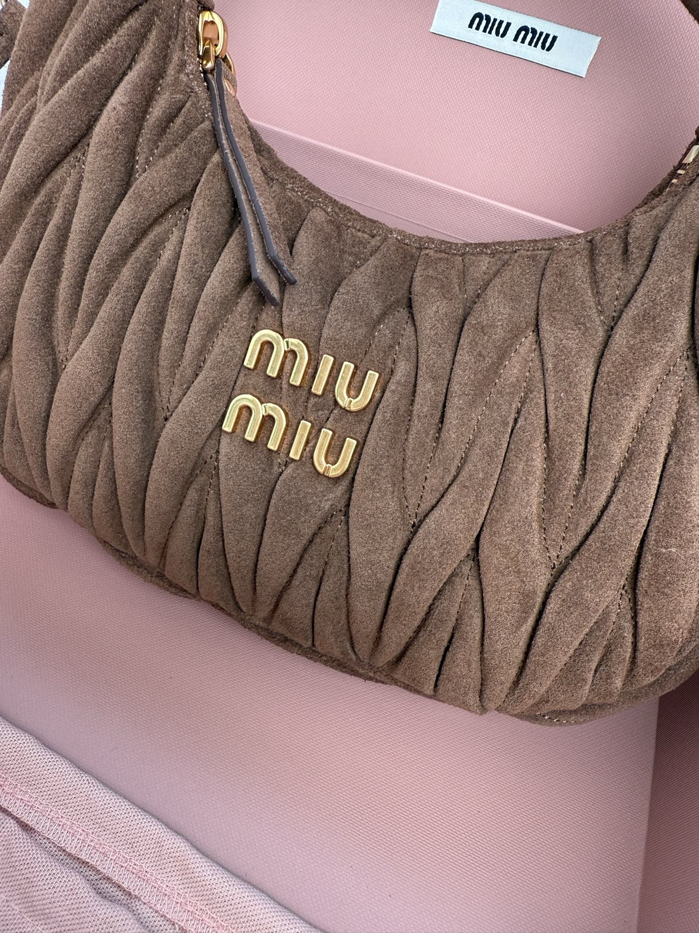 MiuMiu Wander matelassé suede bag