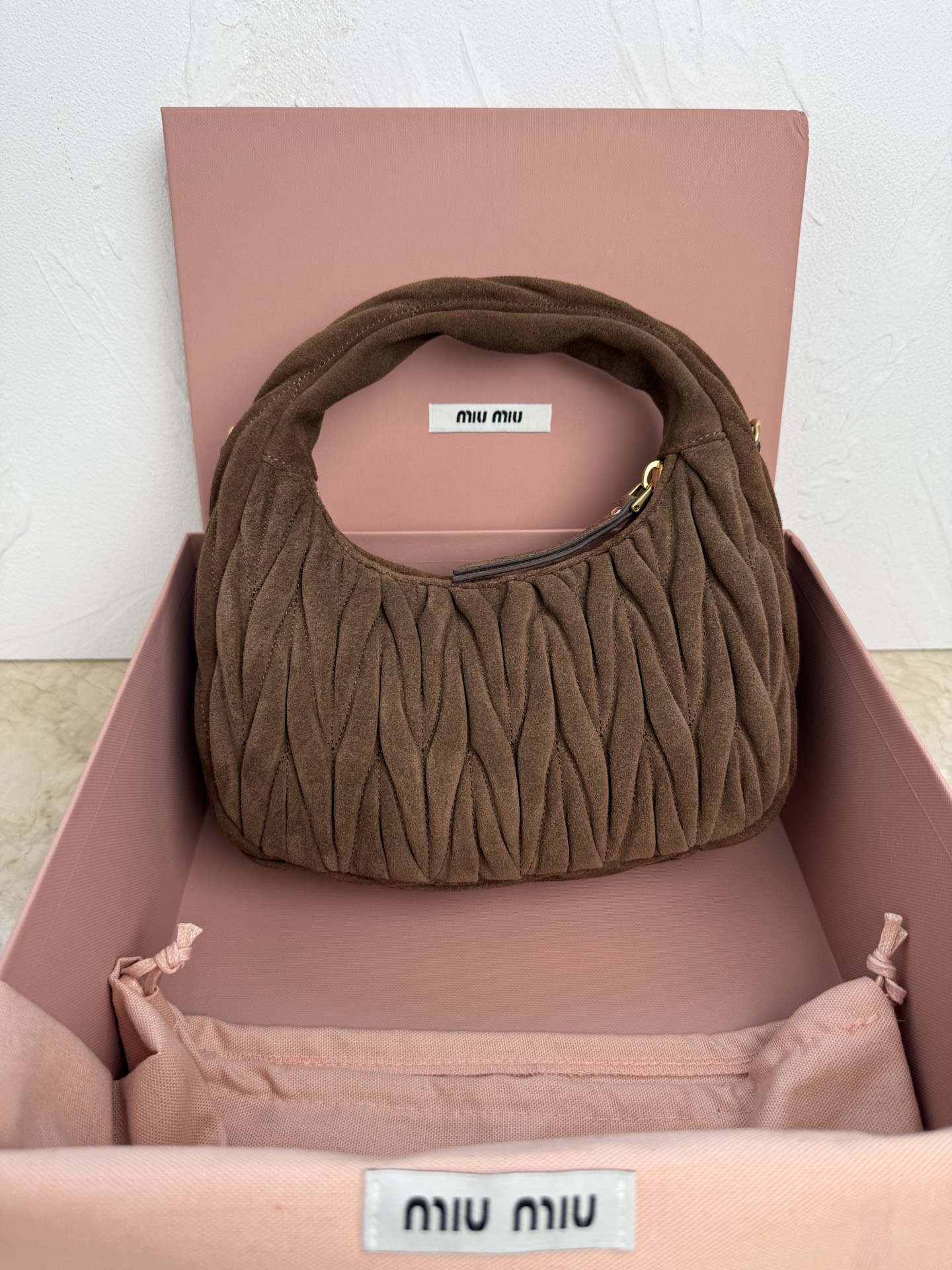 MiuMiu Wander matelassé suede bag