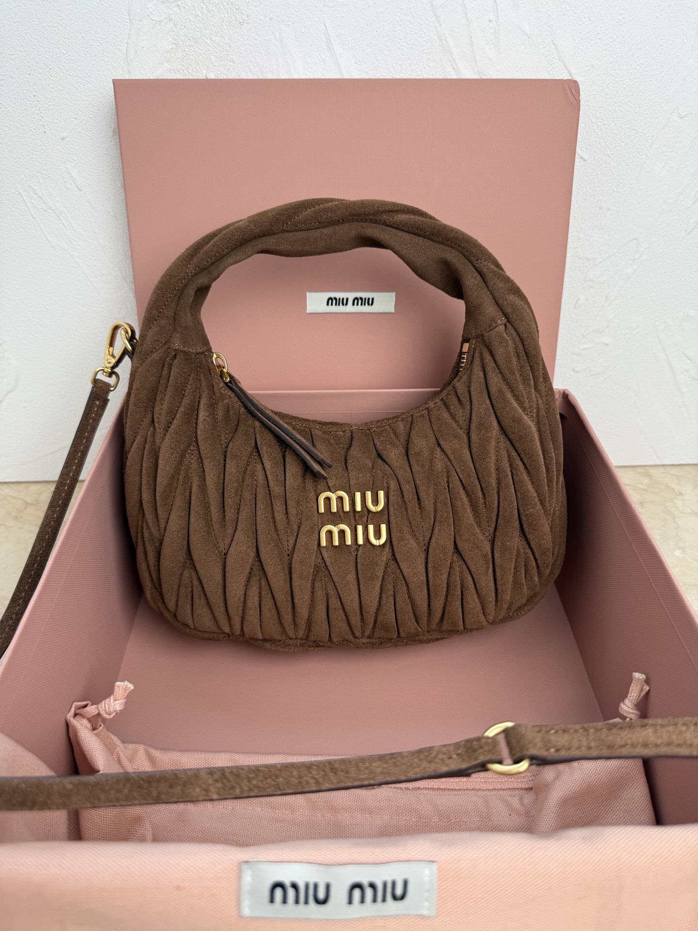MiuMiu Wander matelassé suede bag