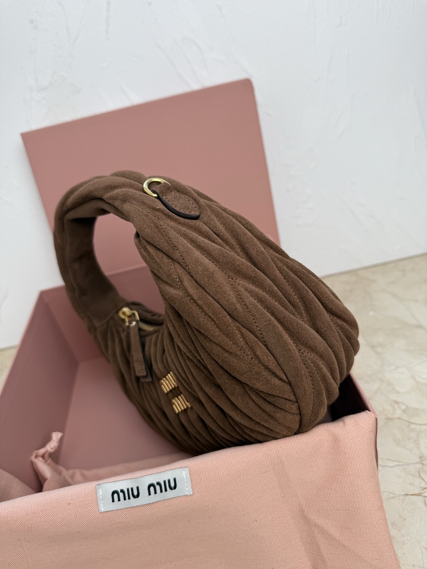 MiuMiu Wander matelassé suede bag