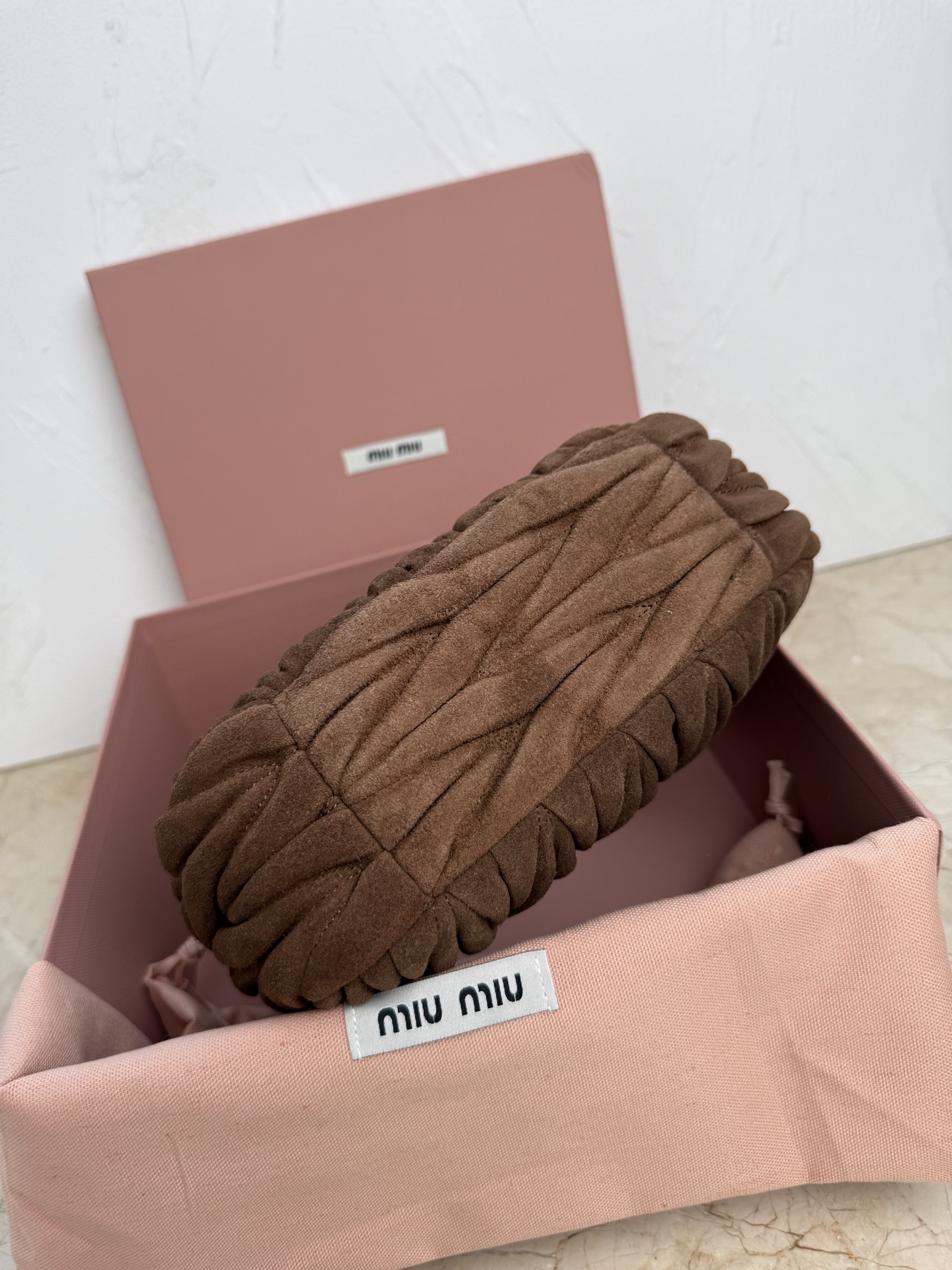 MiuMiu Wander matelassé suede bag