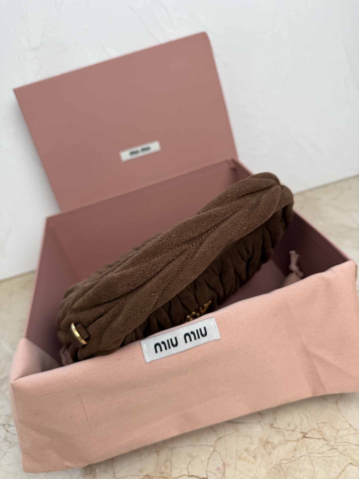 MiuMiu Wander matelassé suede bag