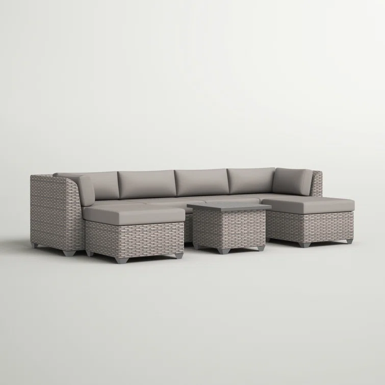 Amjad 7 Piece Outdoor Sectional Seating Group with Cushions