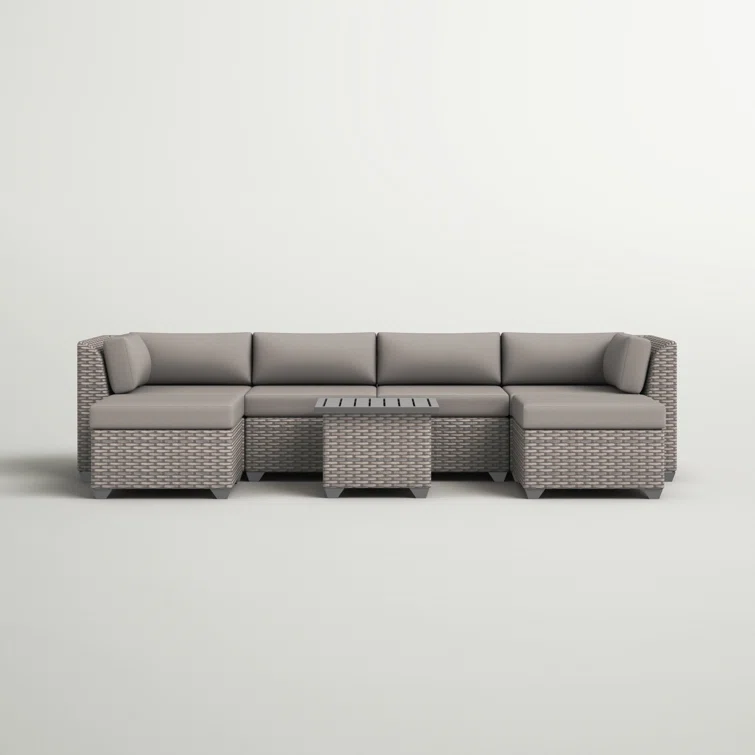 Amjad 7 Piece Outdoor Sectional Seating Group with Cushions